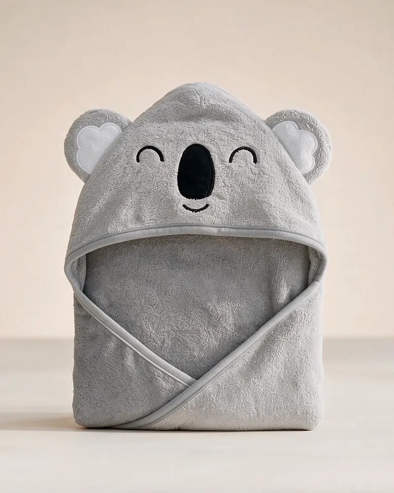 Der schläfrige Koala: graues MiniBoo-Kapuzenhandtuch mit geschlossenen Augen und schwarzer Nase